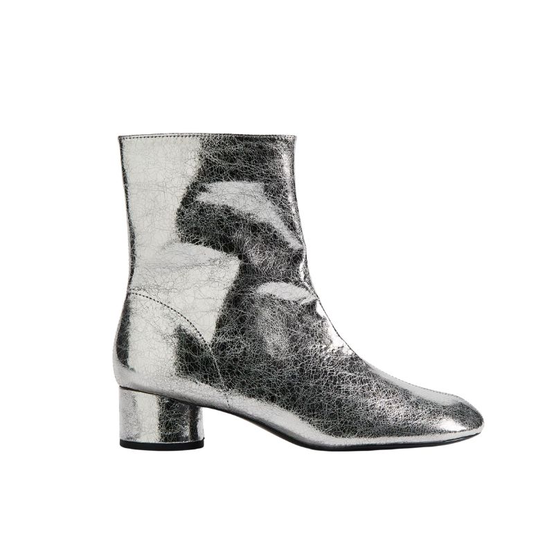 A cutout of a silver ankle boot by H&M