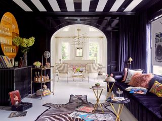 a black room with a white and black striped roof