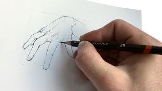 Hand holding a pencil that is sketching a picture of a hand