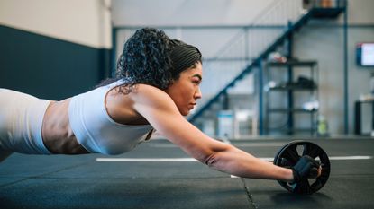 Woman using an ab roller