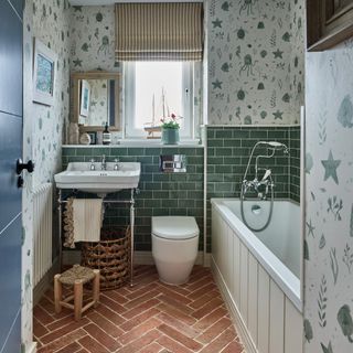 bathroom with green wall tiles and wallpaper