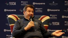 Sir Nick Faldo speaks into a microphone while sat in a Union Jack chair ahead of the 2026 British Masters