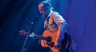 Seb Wesson plays his Martin D-28 acoustic onstage