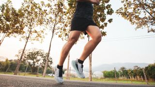 Close-up of a male runner's legs