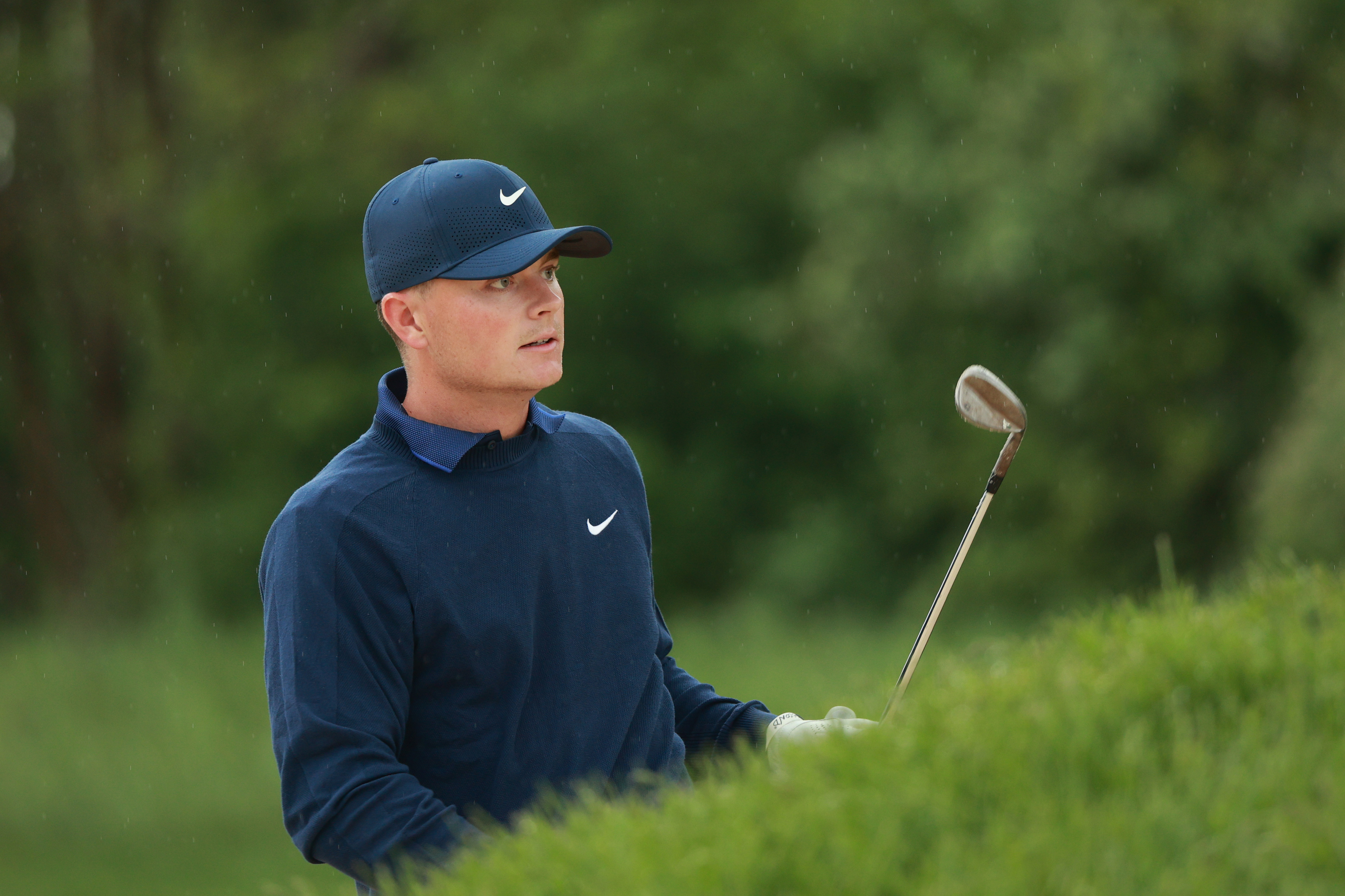 Luke Clanton watches a shot from the bunker