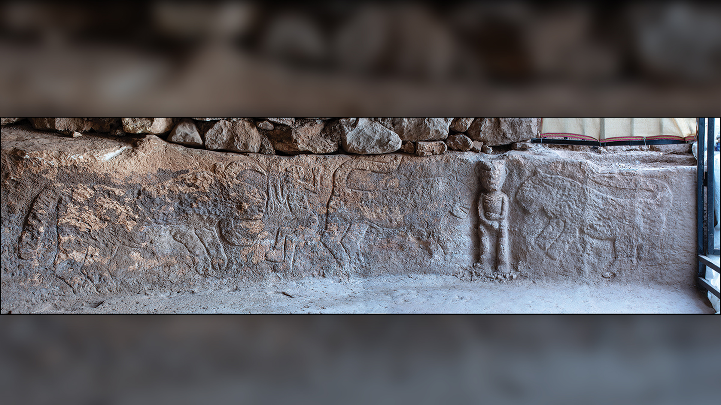 The Sayburç relief features two leopards, a bull and the two men.