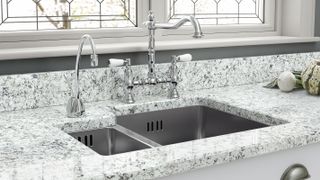 inset stainless steel sink with traditional kitchen tap