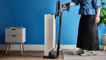 Roborock H60 Hub Ultra photograped in front f a blue background