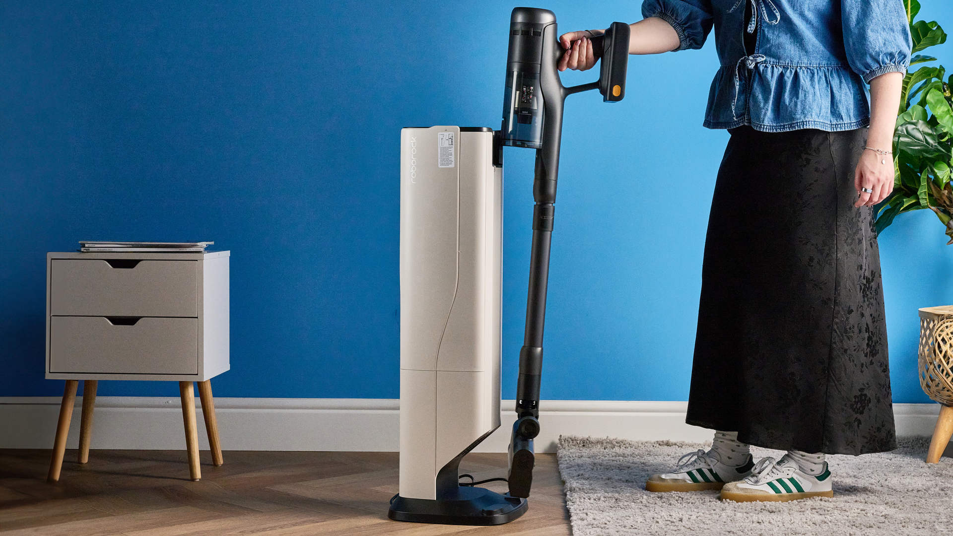 Roborock H60 Hub Ultra photograped in front f a blue background