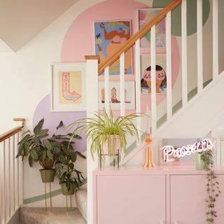 Decorated pink stairway and wall art