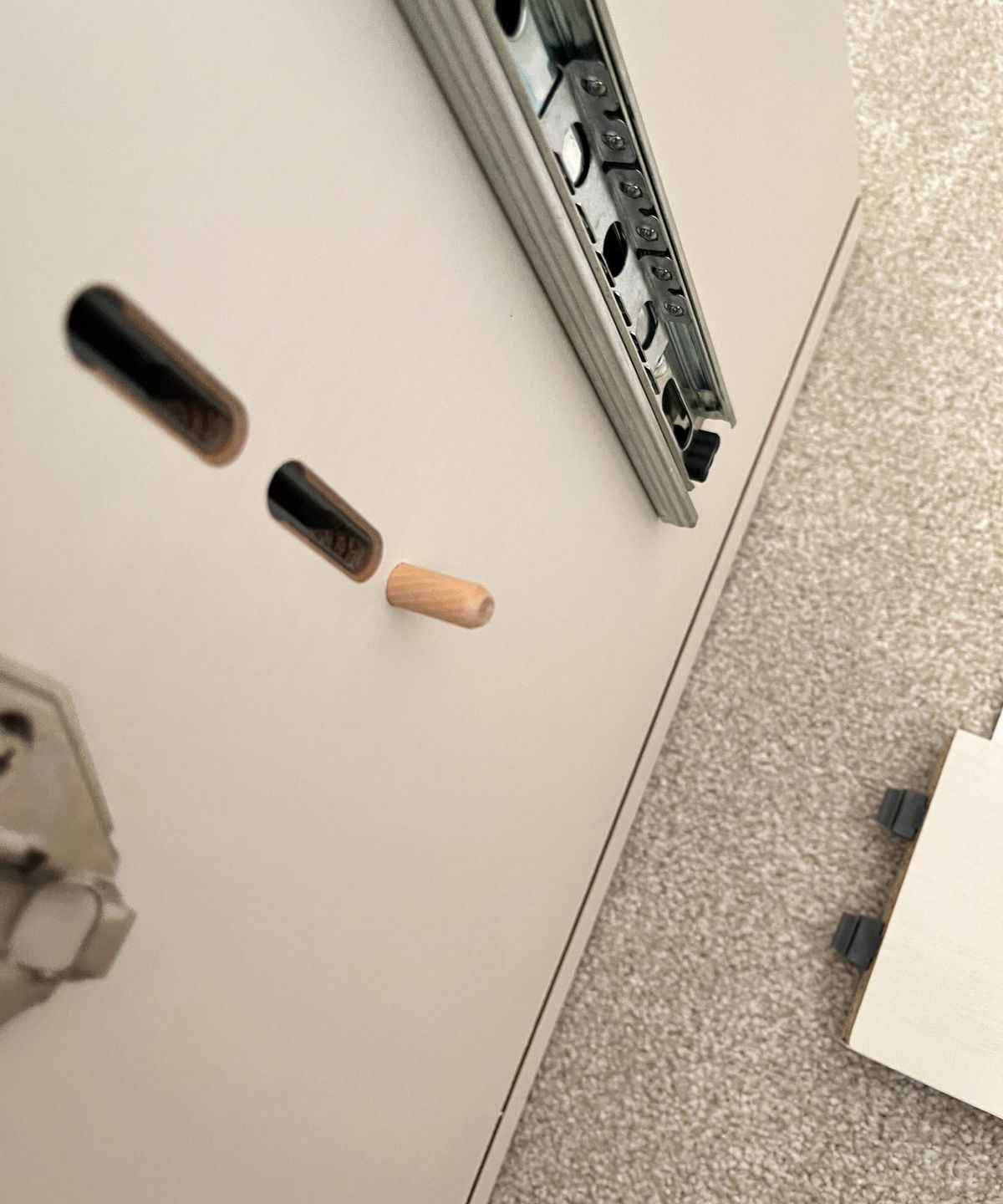 piece of furniture with plastic receiver built in to the side of the unit
