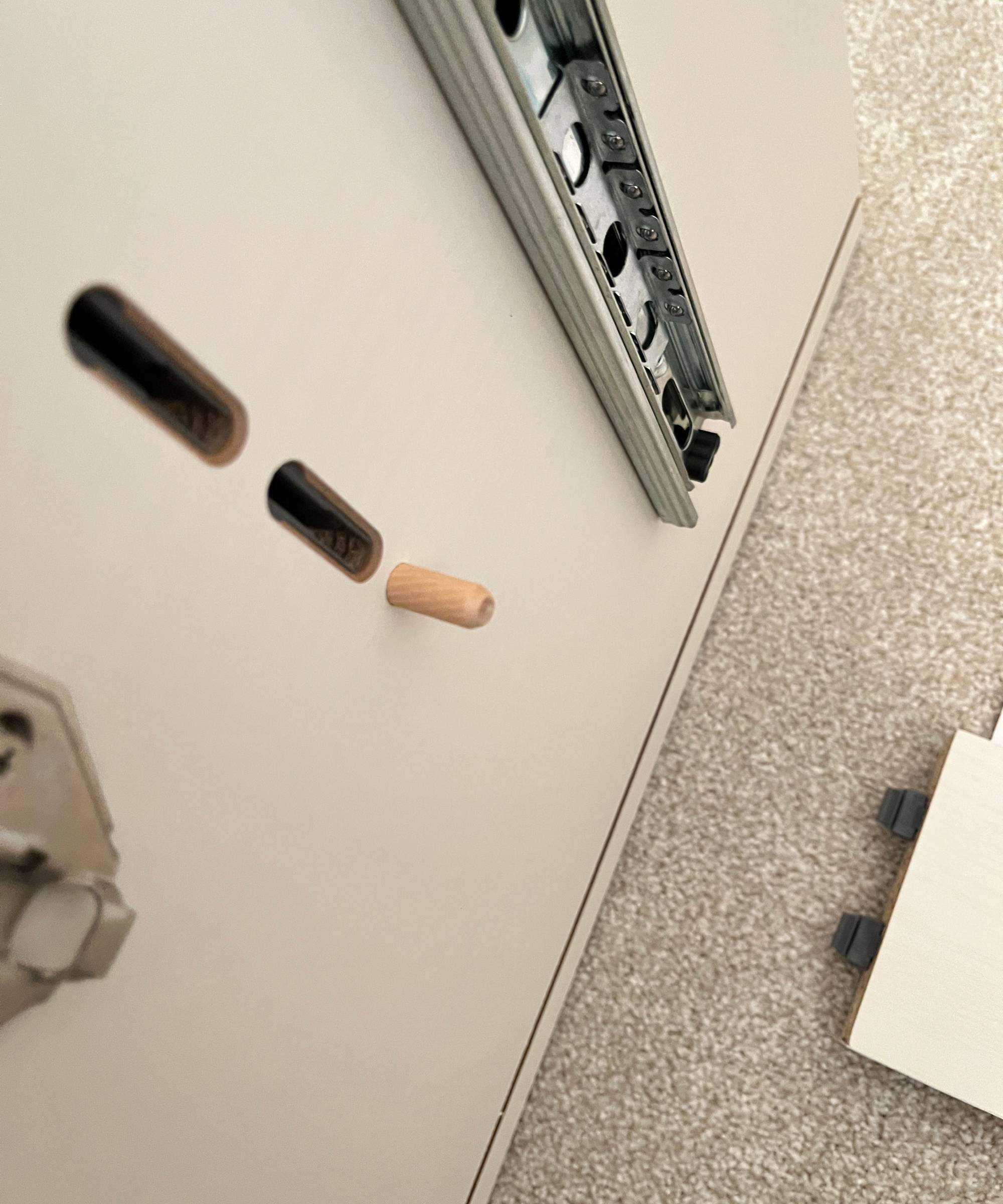 piece of furniture with plastic receiver built in to the side of the unit