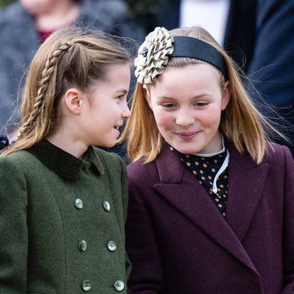 Princess Charlotte and Mia Tindall talking and smiling