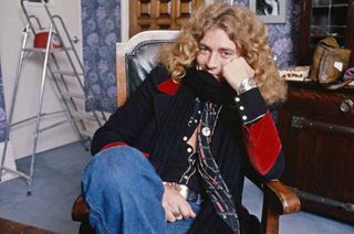 Robert Plant sitting in a chair