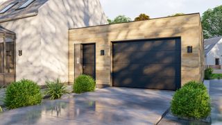 A modern house with a driveway and a garage with a grey door
