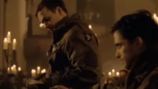 Donnie Wahlberg in a church surrounded by candles in Band of Brothers