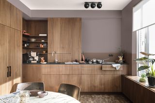 wooden kitchen with purple scheme by dulux