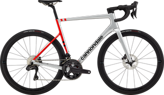 A white bike with a red seattube against a white background