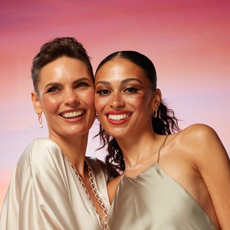 Two models smiling wearing make- up sold at LOOKFANTASTIC
