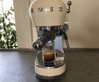 Smeg ECF02 making an espresso