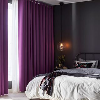 bedroom with purple verticle blinds