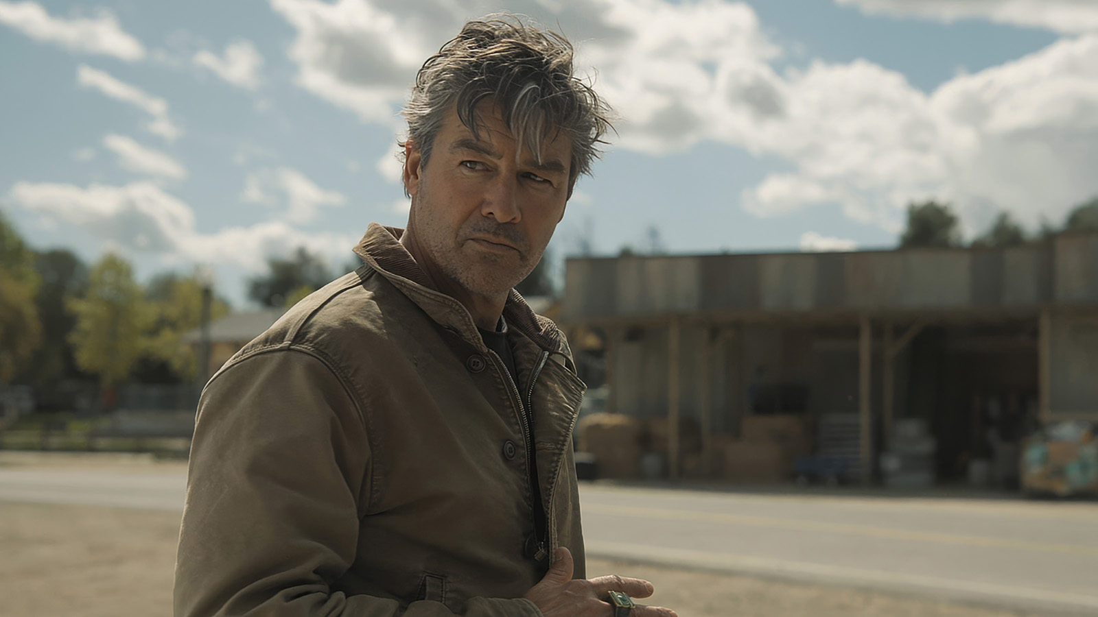 Hal Jordan looking over his right shoulder in HBO's Lanterns TV show