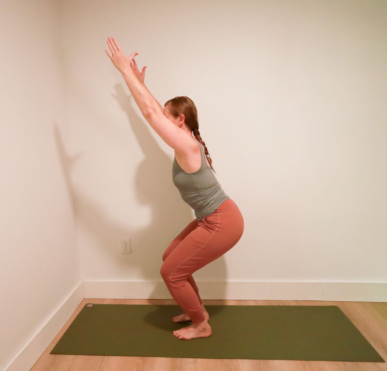 Woman demonstrates yoga pose