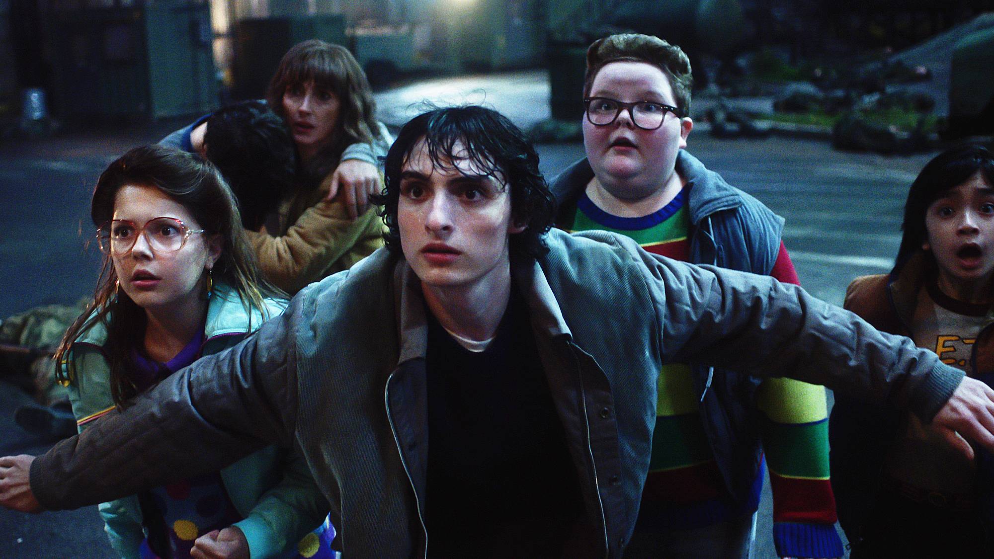 Winona Ryder as Joyce Byers, Finn Wolfhard as Mike Wheeler and Jake Connelly as Derek in 
