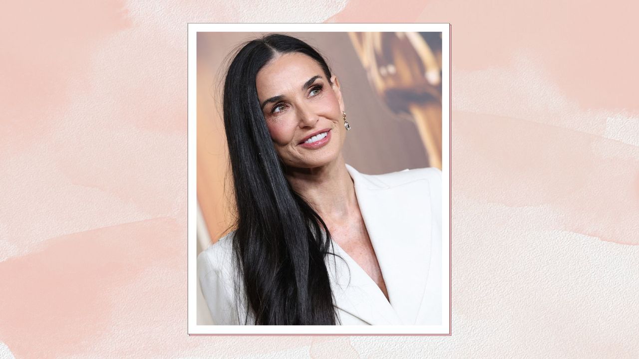 a pink frame containing a picture of Demi Moore in a white suit with long, glossy, shiny hair 