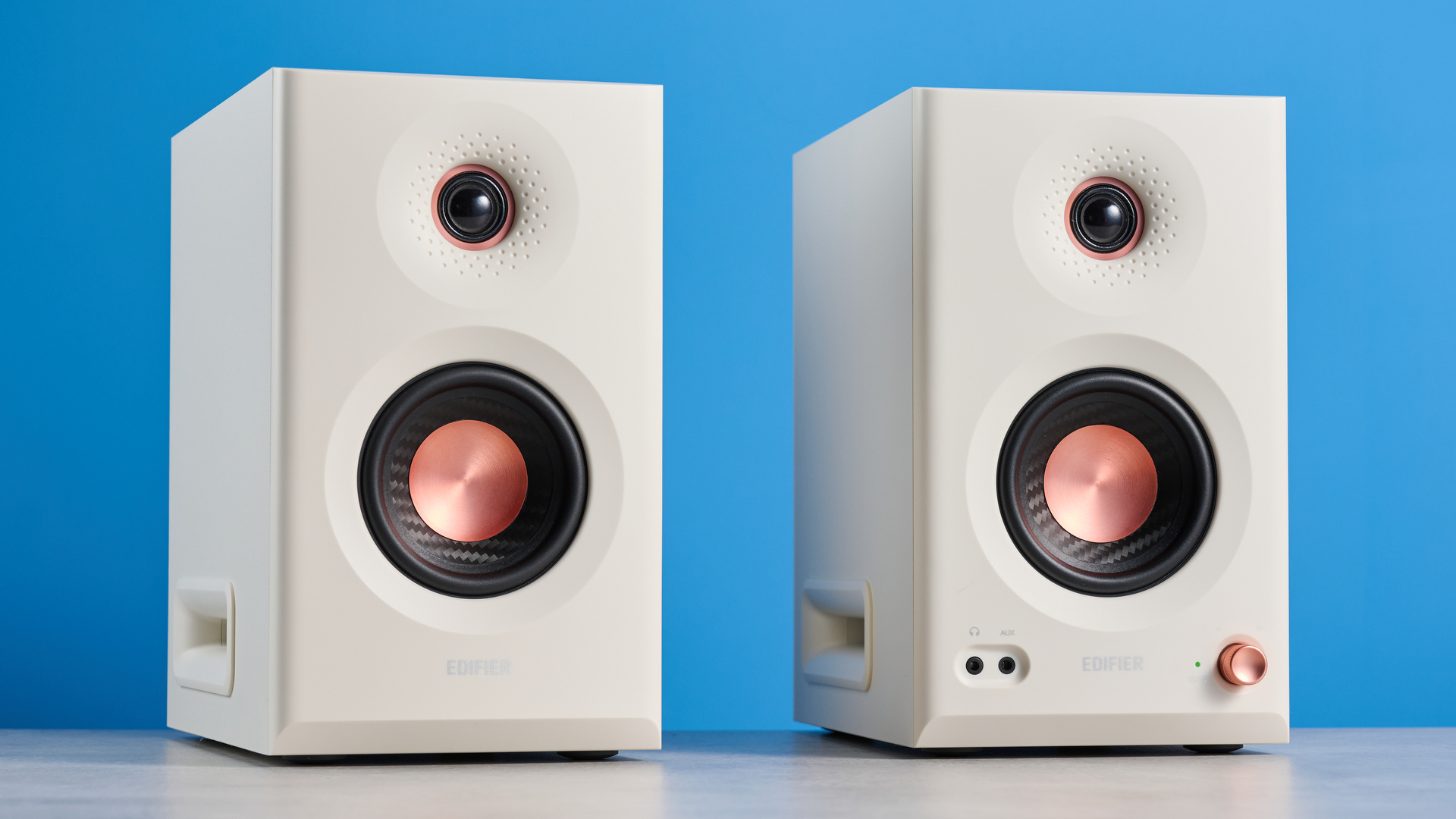the Edifier MR5 studio monitors bookshelf speakers photographed with the blue tom's guide background