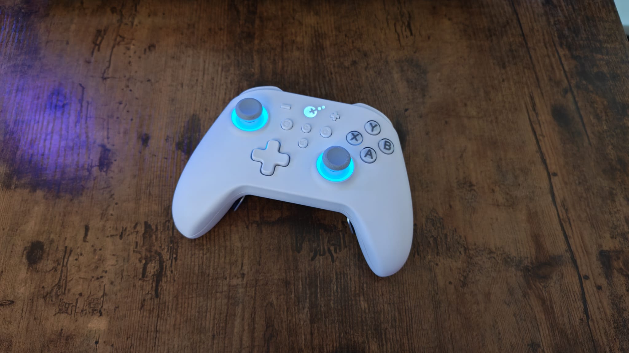 A white Gulikit KK3 Max with blue RGB lighting