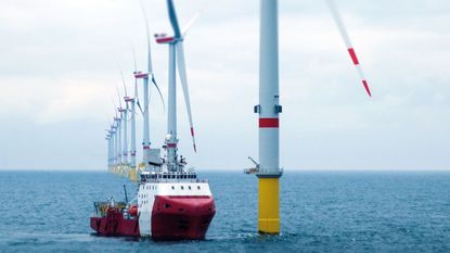 Boat at an offshore windfarm © Getty