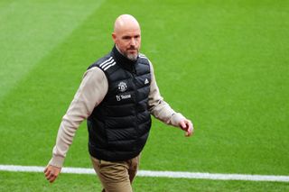 Manchester United boss Erik ten Hag walks on the touchline during a Premier League game as Jamie Carragher offers sympathy