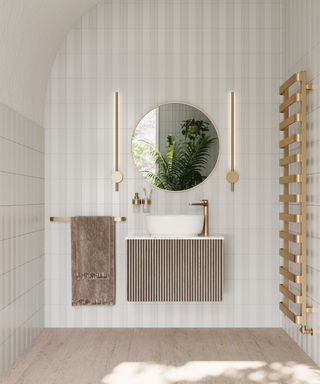 stylish bathroom with curved ceiling, simple colour palette of brushed gold, stone and white