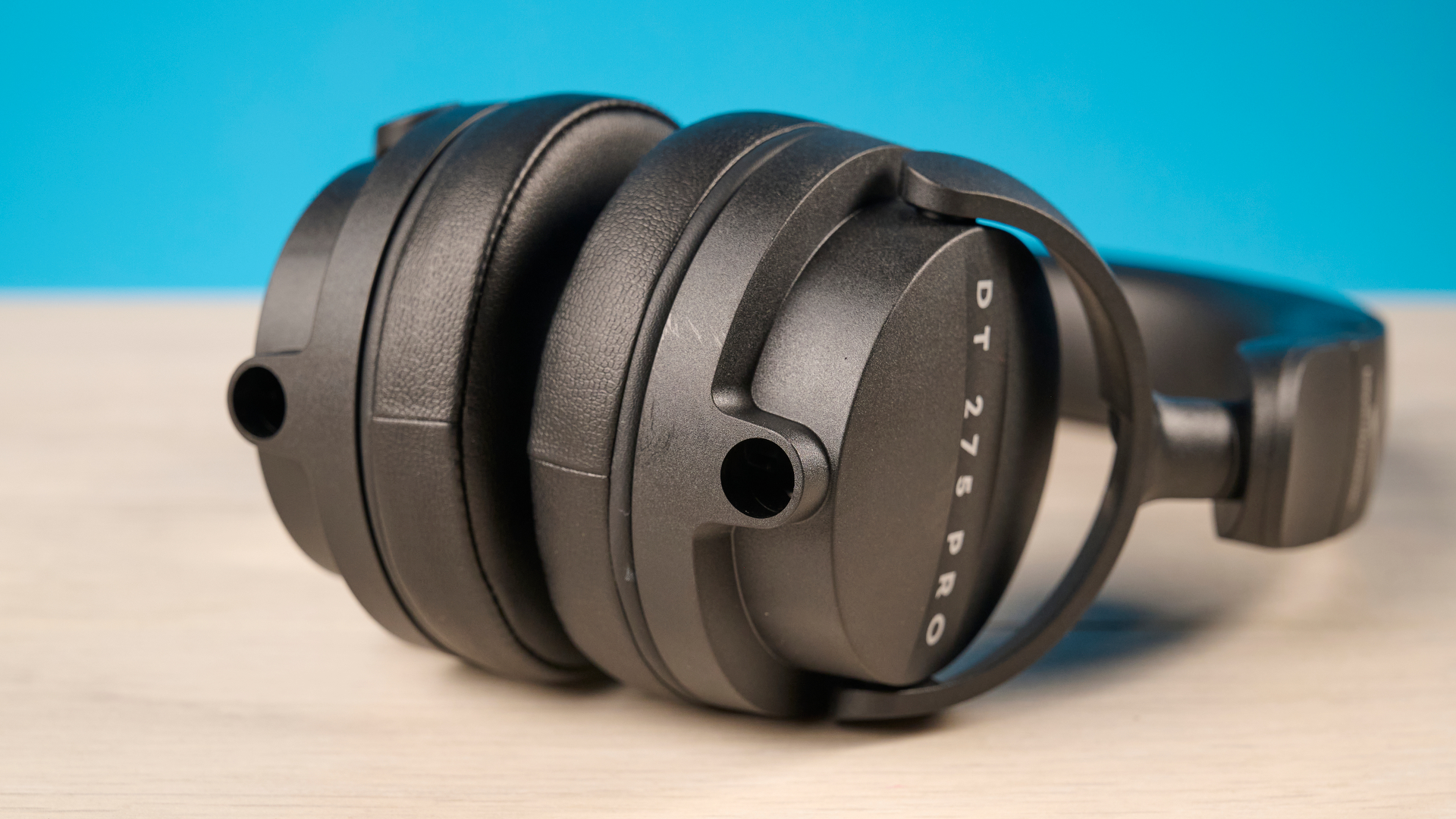 Beyerdynamic DT 275 Pro photographed in front of a blue background