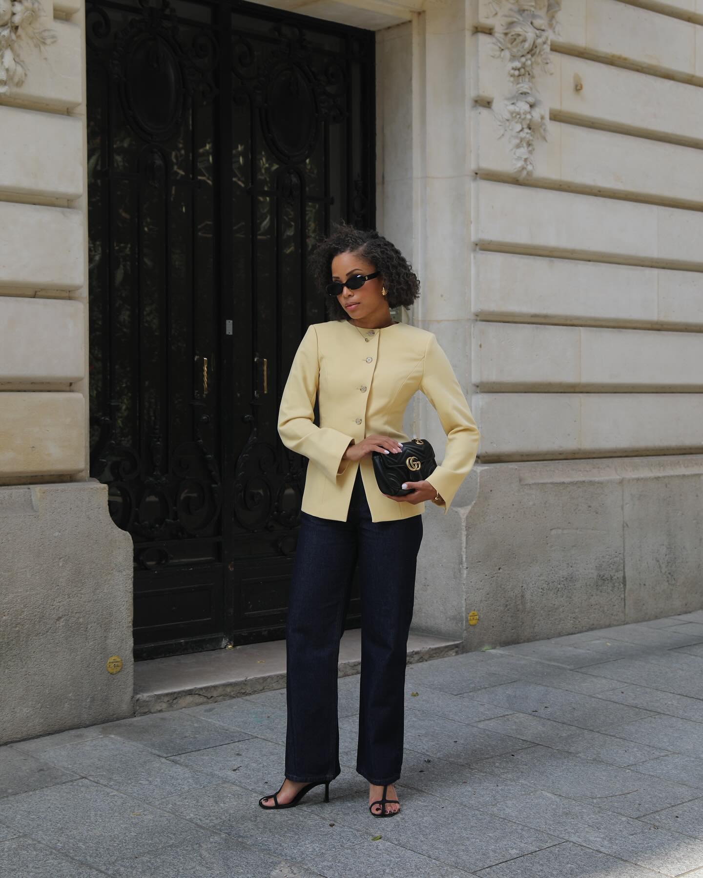 @slipintostyle wearing a yellow Aligne blazer with black pants.