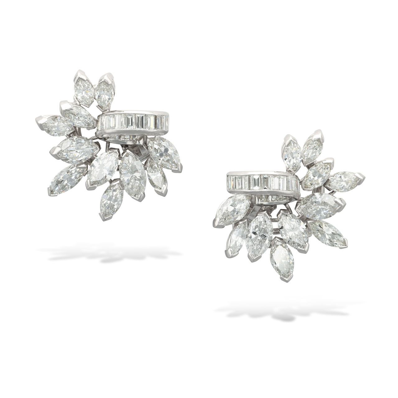 A pair of stud diamond earrings with baguette and marquise-cut stones