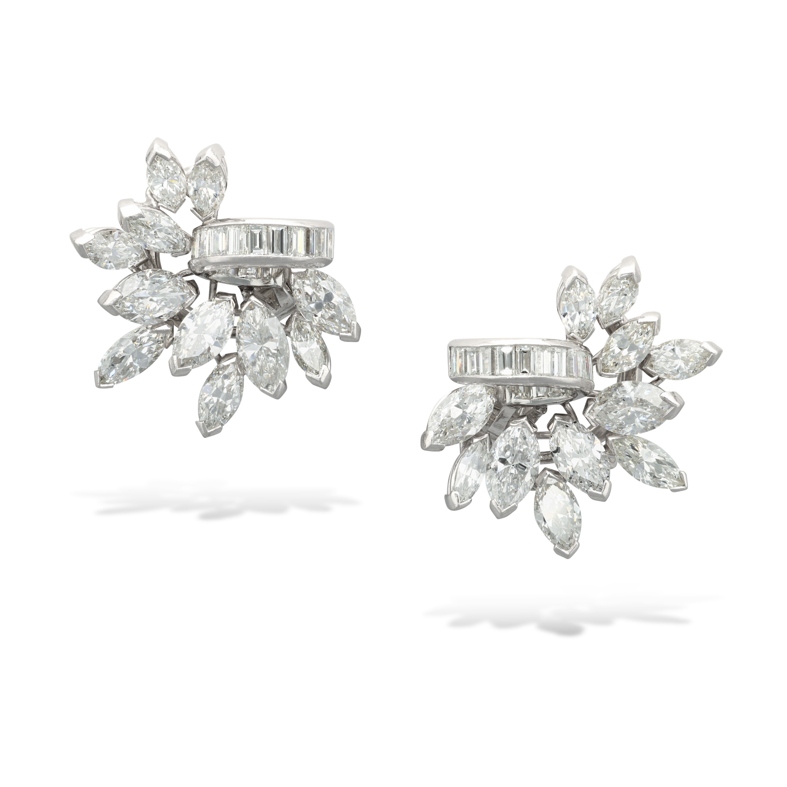 A pair of stud diamond earrings with baguette and marquise-cut stones