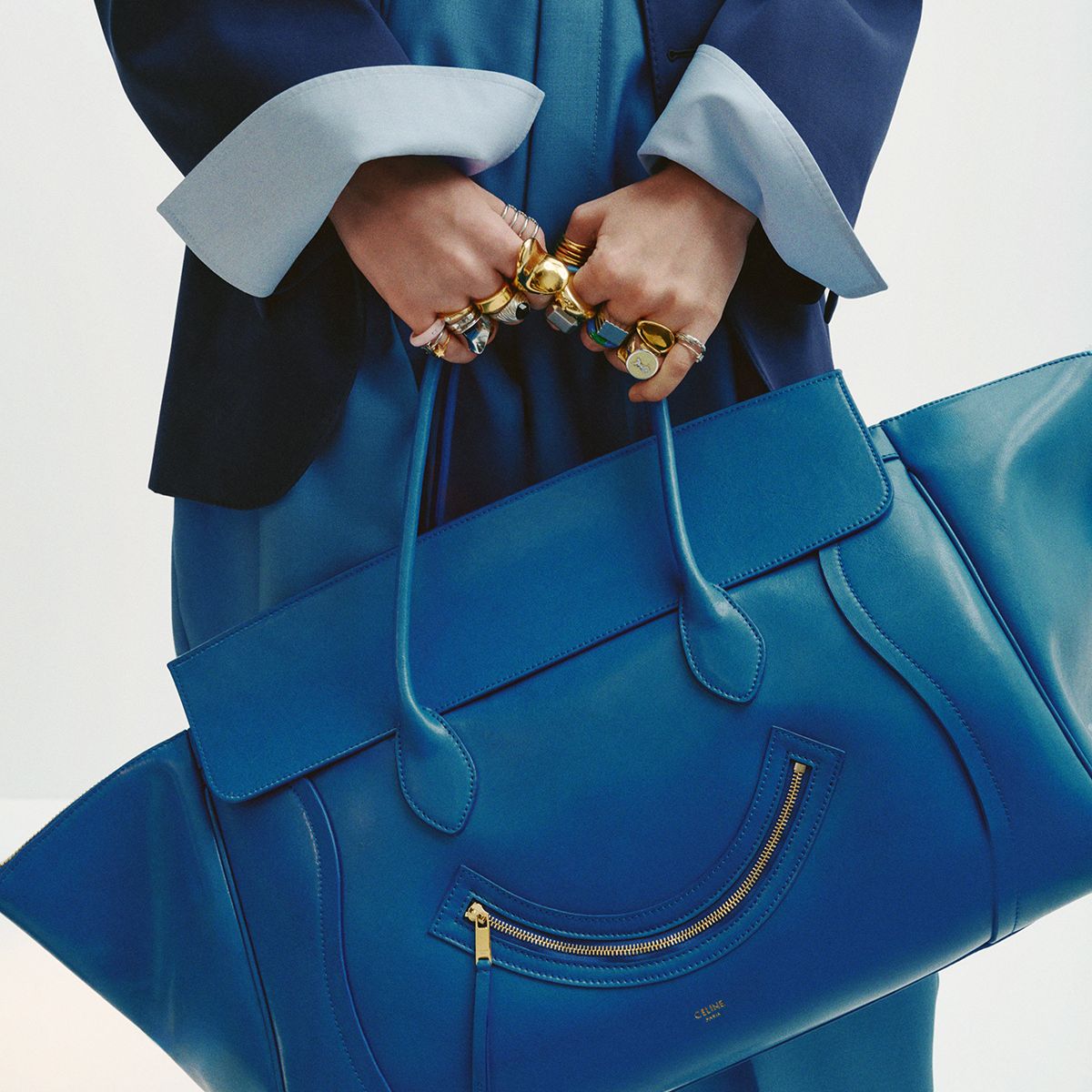 a model carries a celine new luggage bag
