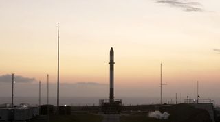 A Rocket Lab Electron booster stands on the pad in New Zealand ahead of the planned Jan. 16 launch of the 