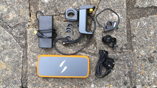 Swytch e-bike conversion upgrade kit showing charger, bracket & spacers, display, throttle, UK plug and Max battery
