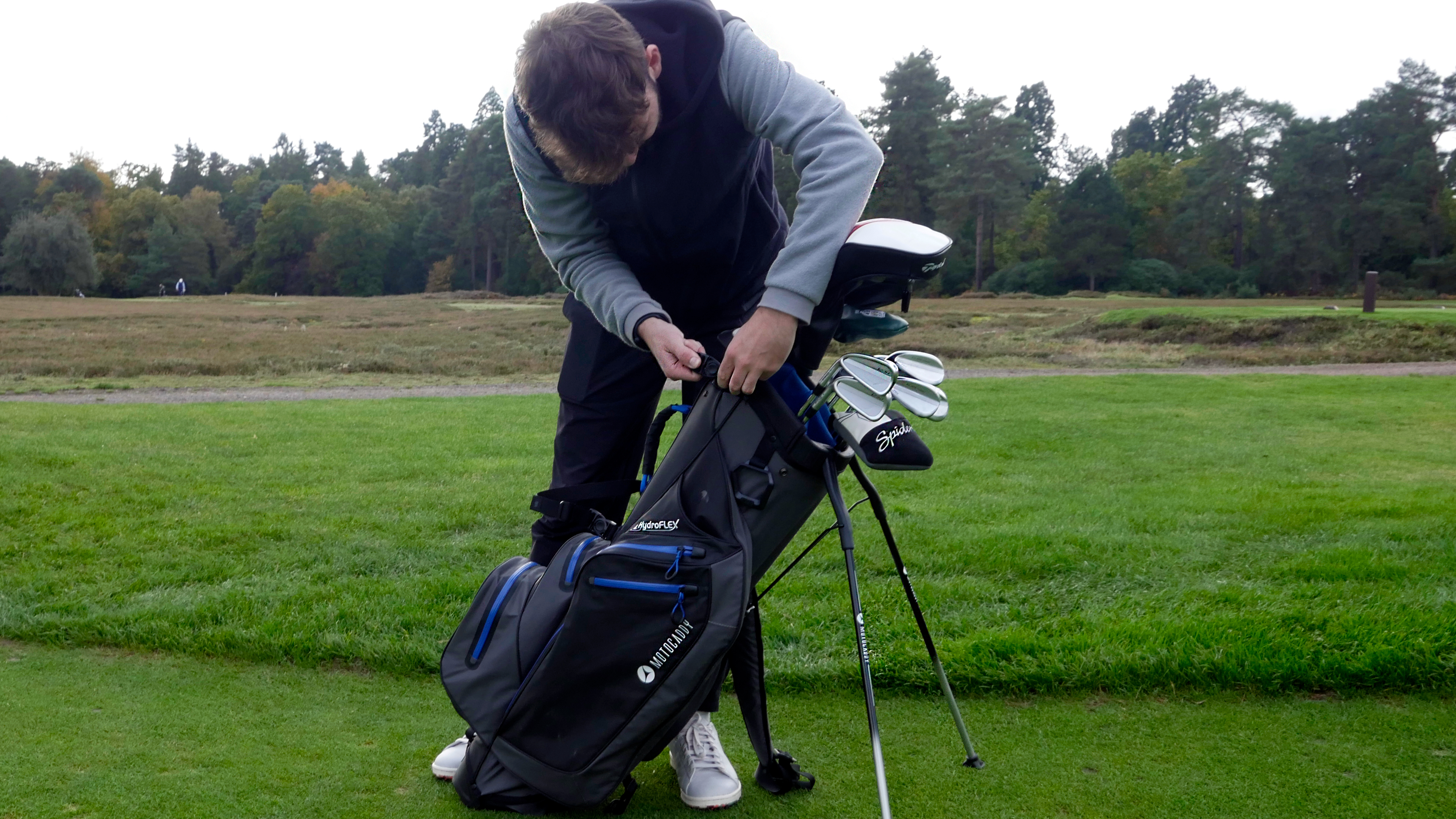 Dan Parker adjusting the straps on the 2023 Motocaddy Hydroflex