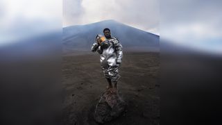 "There was ash billowing out from the volcano, it was sulphuric acid," says the photographer behind award-winning volcanologist portrait &ndash; but why is he barefoot on a rock? 