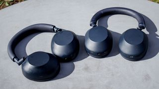 The Sony WH-1000XM5 and XM6 on a table outside
