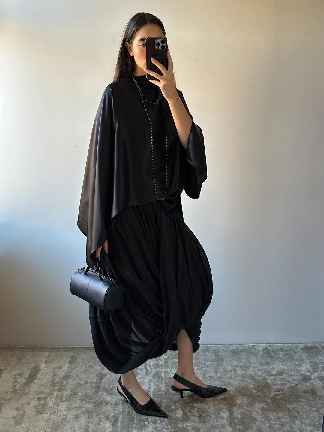 fashion influencer Selena Mual wearing a silk cape top