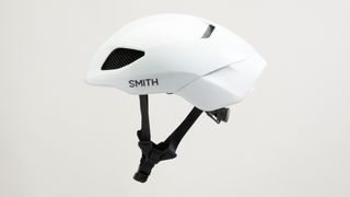 A white Smith Ignite helmet with small black SMITH logo on the outside