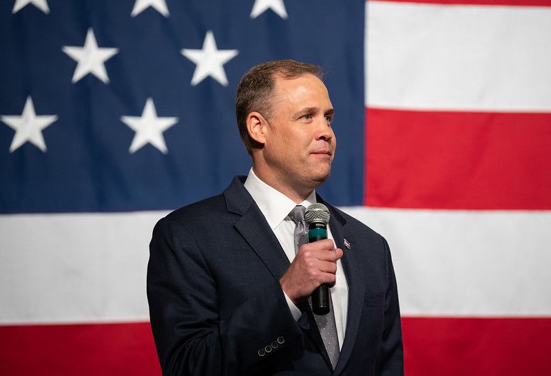 In this October 2019 photo, NASA chief Jim Bridenstine helps unveil two spacesuits the agency is designing for its Artemis moon program.