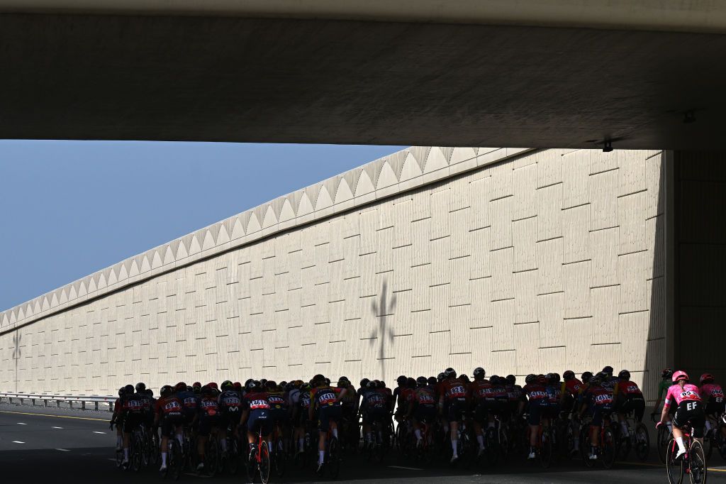 ABU DHABI BREAKWATER UNITED ARAB EMIRATES FEBRUARY 09 A general silhouette of the peloton passing through a bridge during the 3rd UAE Tour Women Stage 4 a 127km stage from Abu Dhabi Fatima Bint Mubarak Ladies Academy to Abu Dhabi Breakwater UCIWWT on February 09 2025 in Abu Dhabi Breakwater United Arab Emirates Photo by Tim de WaeleGetty Images