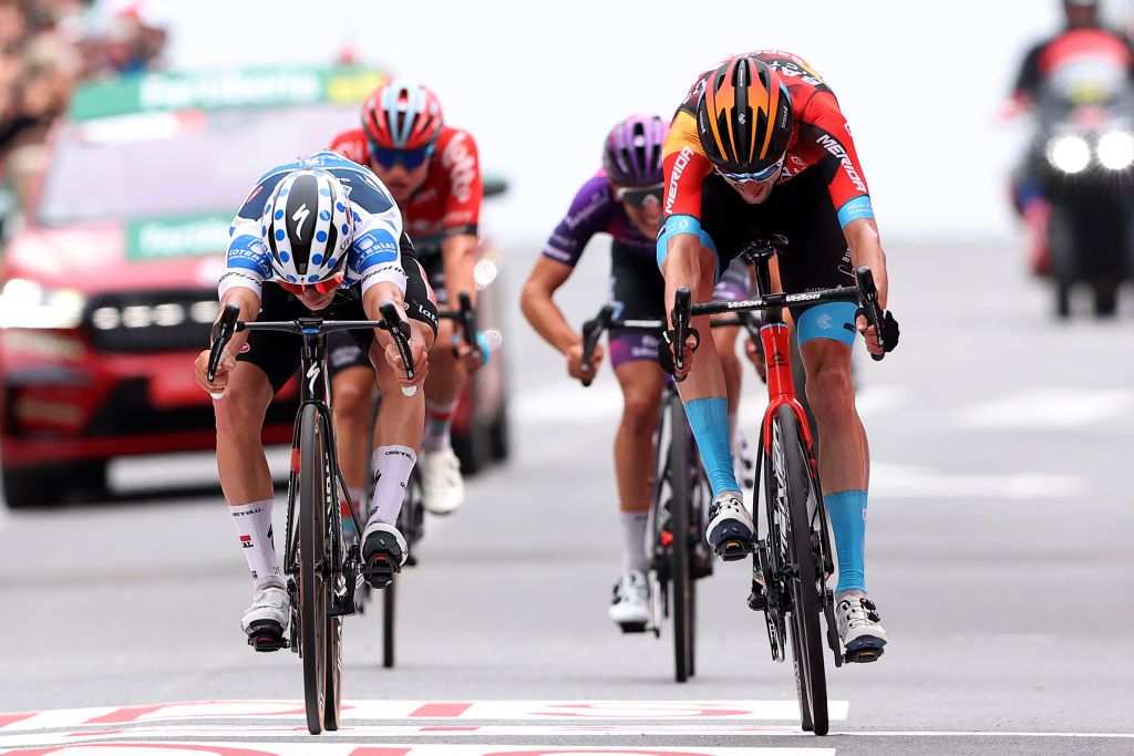 GUADARRAMA SPAIN SEPTEMBER 16 LR Remco Evenepoel of Belgium and Team Soudal Quick Step Polka dot Mountain Jersey and Wout Poels of The Netherlands and Team Bahrain Victorious sprint at finish line to win the stage during the 78th Tour of Spain 2023 Stage 20 a 2078km stage from Manzanares El Real to Guadarrama UCIWT on September 16 2023 in Guadarrama Spain Photo by Alexander HassensteinGetty Images