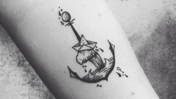 Monochrome anchor tattoo